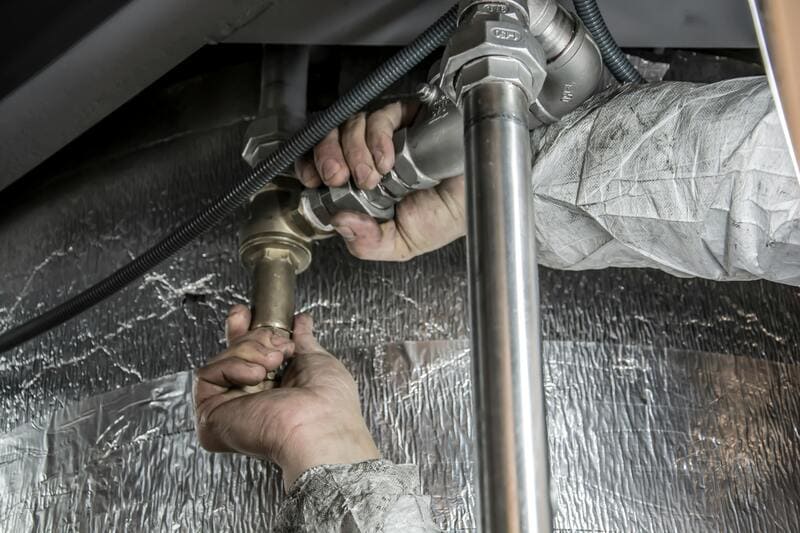 Plumbing contractor at work